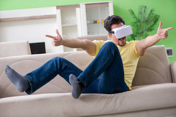 Young man with virtual reality goggles - Photo, Image