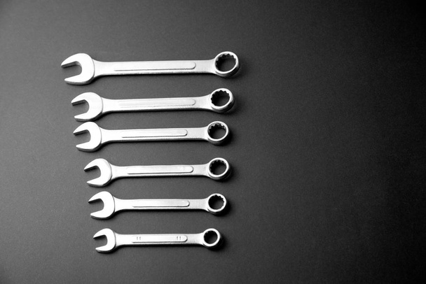 Wrenches on a black background. Tools for repairing.Black and white, monochrome. - Foto, Imagem