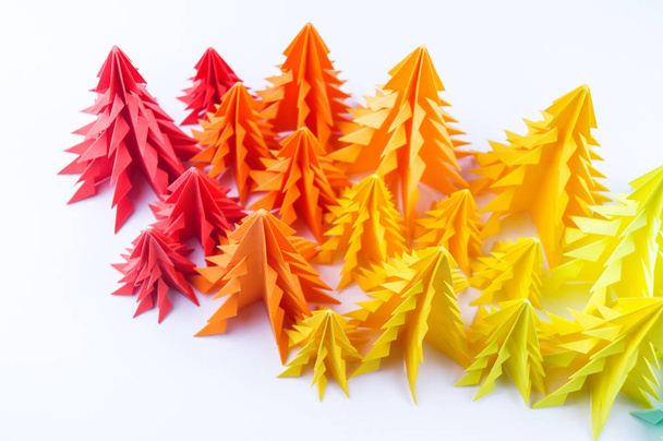 Multicolored paper Christmas tree on a white background. new Year Children's holiday. Rainbow origami - Фото, изображение
