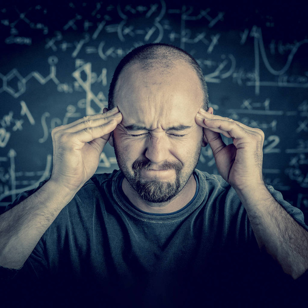 stressed teacher and blackboard background - Photo, Image