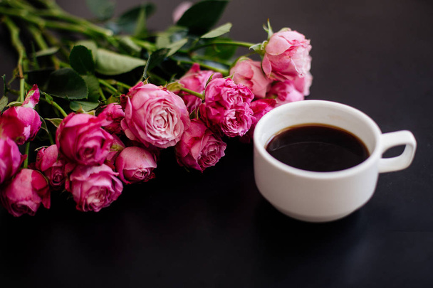 Cappuccino, eclairs and flowers. - Photo, Image