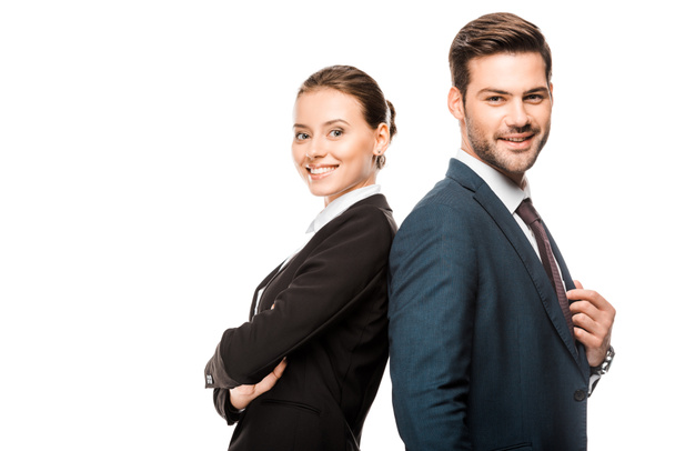happy young business partners leaning back to back and looking at camera isolated on white - Φωτογραφία, εικόνα