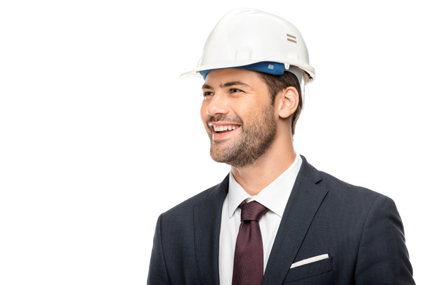 portrait of smiling young male architect looking away isolated on white  - Fotografie, Obrázek