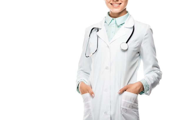 cropped image of young female doctor in medical coat with stethoscope over neck isolated on white - Zdjęcie, obraz