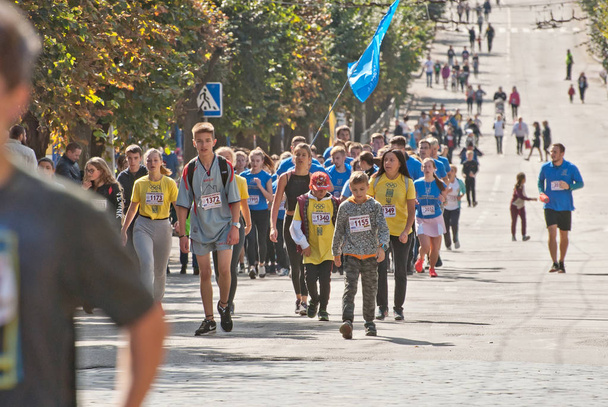 CHERNIVTSI, UKRAINE - SEPTEMBER 30 : Unidentified runners participating in the "Bukovina Mile" charity fun run on September 30, 2018 in Chernivtsi, Ukraine. - Fotó, kép