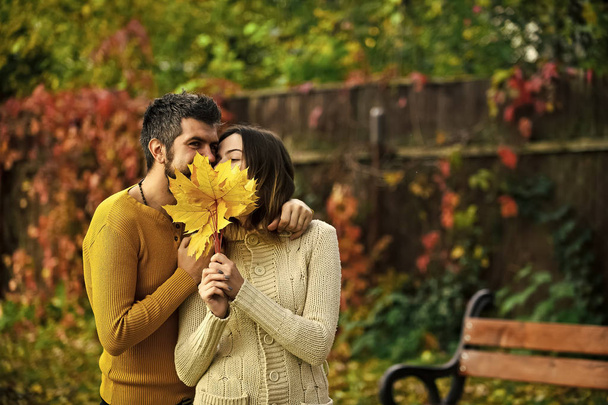 Man and woman with yellow tree leaves. - Foto, imagen