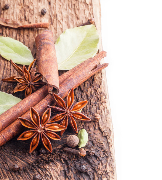 Different spices, Cinnamon, anise on wooden old table - Photo, Image