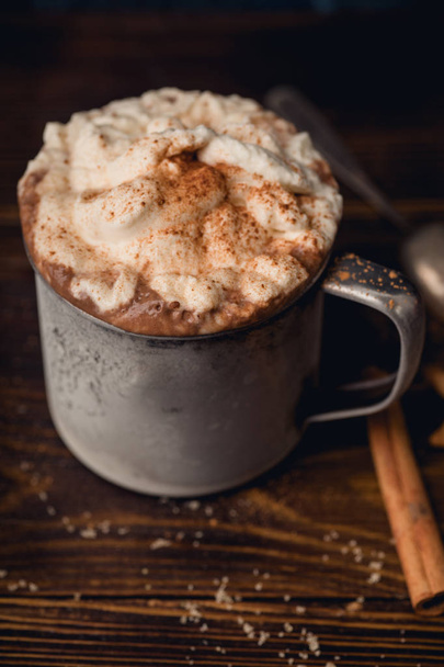 Hot chocolate with whipped cream and cinnamon with and cookies, Winter warming comfort drink concept - 写真・画像