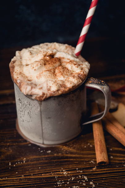Hot chocolate with whipped cream and cinnamon with and cookies, Winter warming comfort drink concept - Fotografie, Obrázek