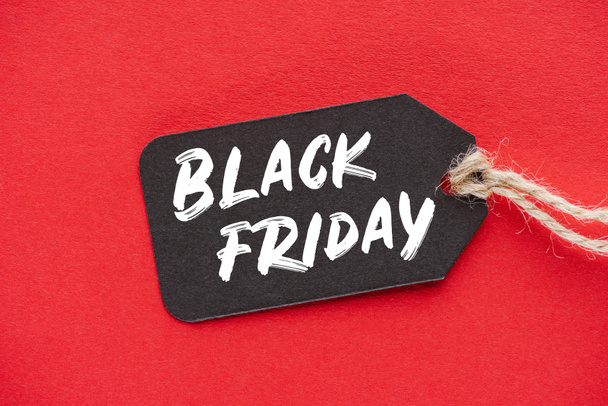 shopping sale tag with black friday sign on red - Photo, Image