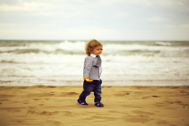 Smiling baby boy on beach - Φωτογραφία, εικόνα