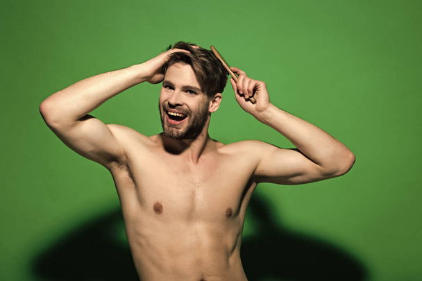 Happy macho with sexy torso, beard, haircut - Фото, изображение