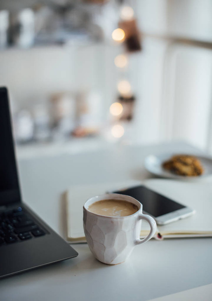 Modern white office, designer handmade cup with coffee, smartpho - Zdjęcie, obraz