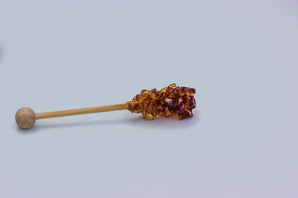 тростинний цукор на паличці
 - Фото, зображення
