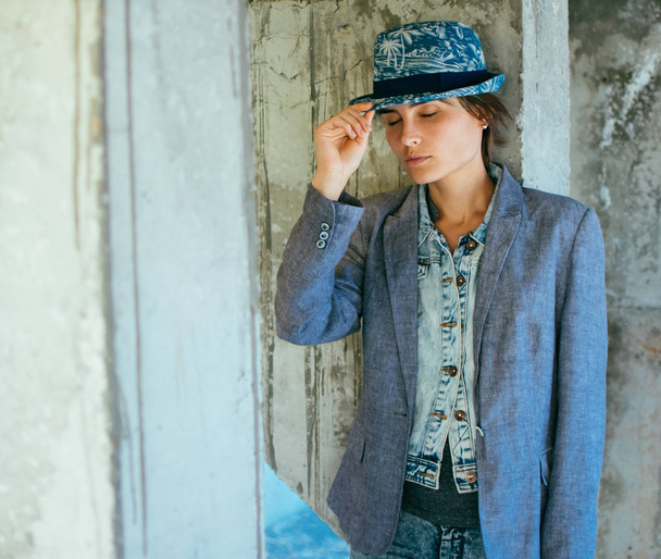 Portrait of a young woman in a hat and jacket. Street style - Fotografie, Obrázek