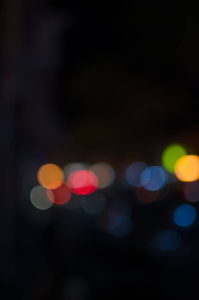 Abstract city night defocused light, blur bokeh, colorful & dark background. - Foto, Imagem