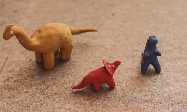 plasticine dinosaurs in bright colors, hand-molded to play - Photo, Image