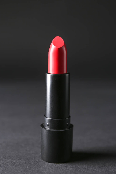 Bright lipstick on black background - Foto, afbeelding