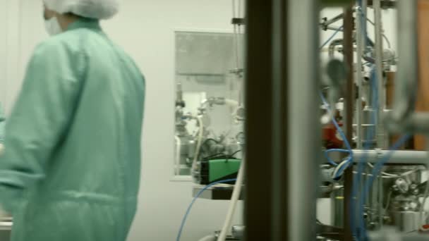 Staff and laboratory technicians at work in medical plant - Footage, Video