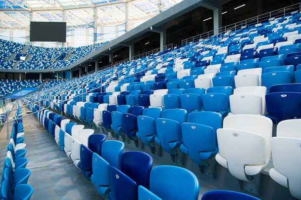 Sport stadium Plastic chairs in a row. - Zdjęcie, obraz