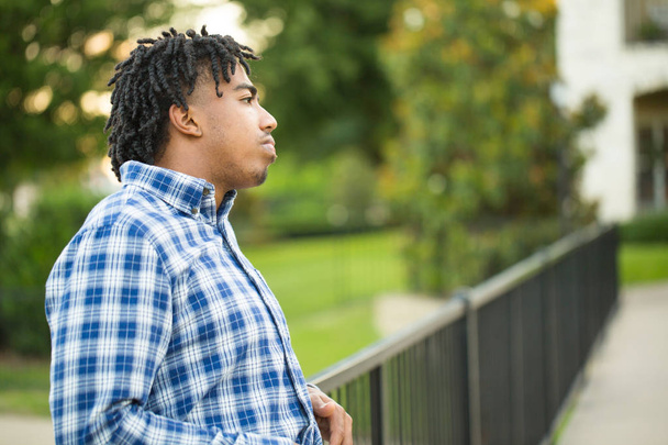 Young African American man in deep thought. - Φωτογραφία, εικόνα