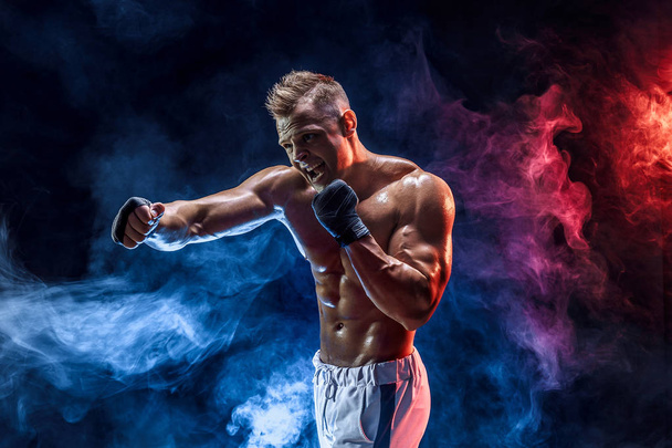 Muscular topless fighter in boxing gloves - Foto, imagen