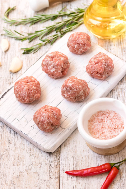 Fresh meat balls of beef and pork mince on a light background - Photo, Image
