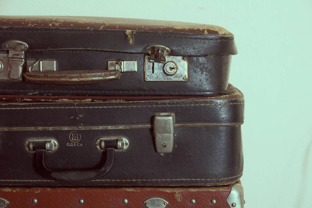 Vintage outdated leather travel suitcases. Retro travel baggage - Fotografie, Obrázek
