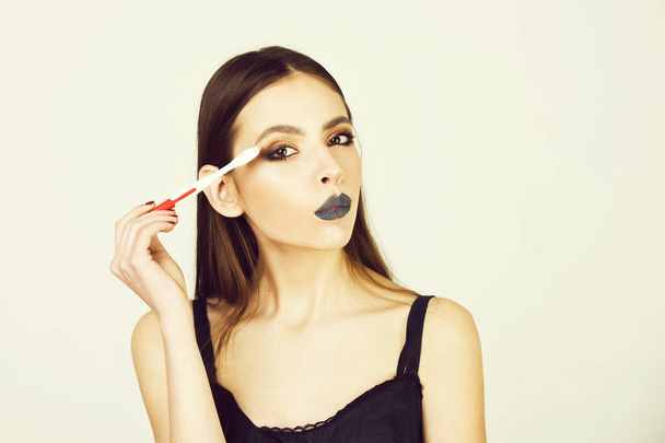 girl with teeth brush, has fashionable makeup - Zdjęcie, obraz