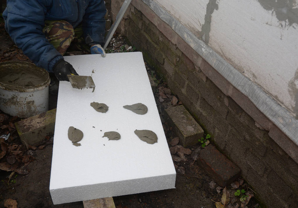 External wall insulation. Foam Sheathing. Exterior wall styrofoam insulation. - Photo, Image