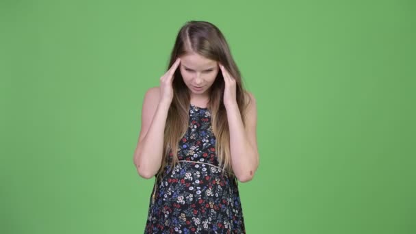Young stressed pregnant woman having headache - Felvétel, videó
