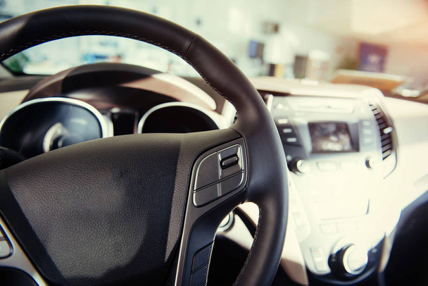 Modern car illuminated dashboard and steering wheel. - Zdjęcie, obraz