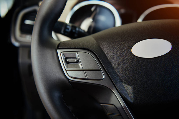 Modern car interior dashboard and steering wheel. - Fotó, kép