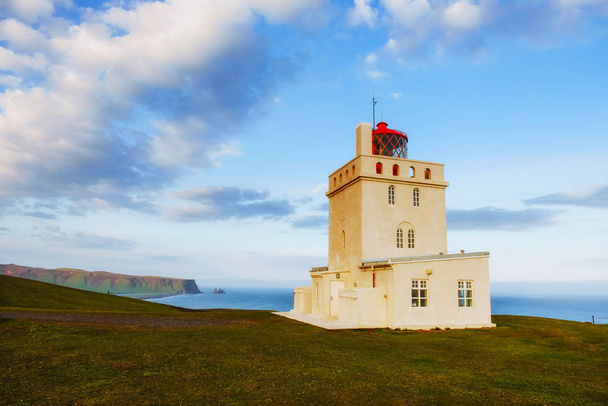 Beautiful white lighthouse at Cape Dyrholaey, South Iceland. - 写真・画像