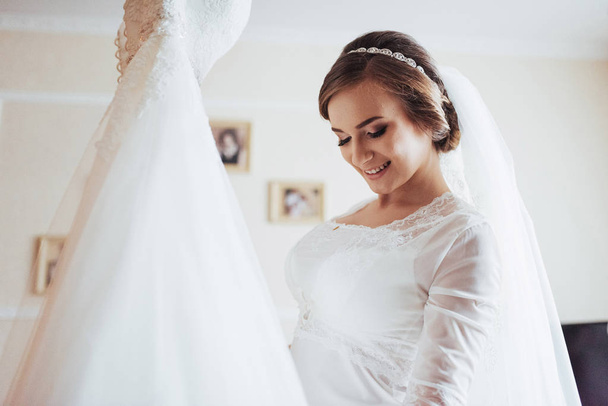 girl trying on wedding dress. best day in my life - Valokuva, kuva