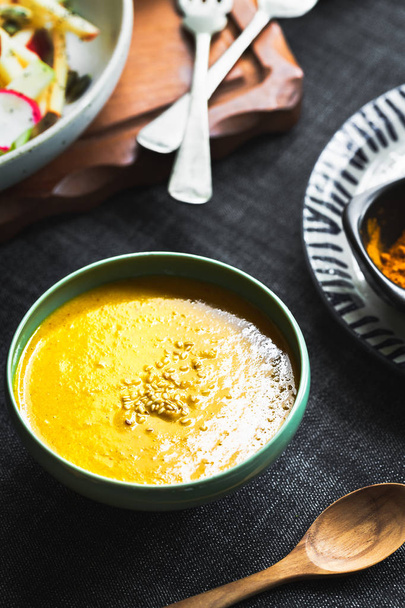 Homemade Tahini with Turmeric salad dressing in a bowl by some ingredients - Photo, Image
