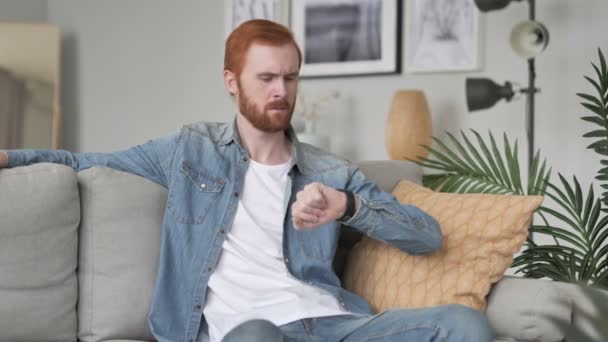 Serious Man Sitting on Sofa in Creative Space - Felvétel, videó