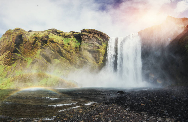 Great waterfall Skogafoss in south of Iceland near the town of Skogar. Colorful rainbow color. - Fotó, kép