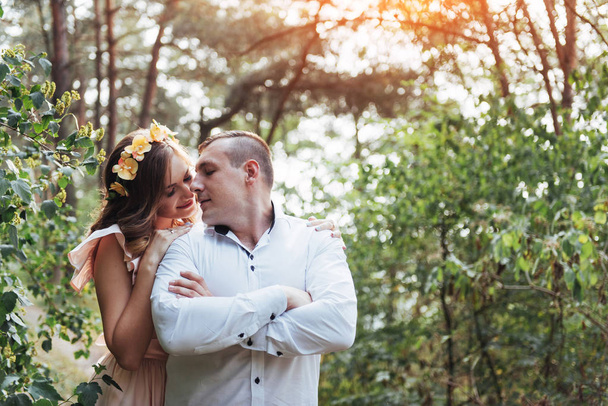 Beautiful happy couple on a walk in the woods. - Photo, image
