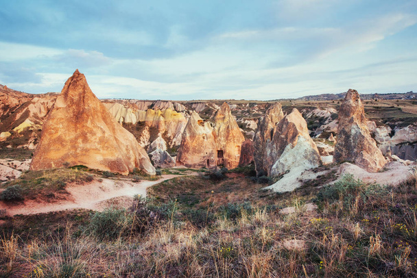 Unique geological formations in valley in Cappadocia, Central Anatolia, Turkey.  - Fotoğraf, Görsel