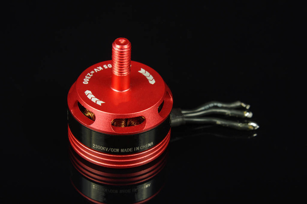 Small brushless motor for racing drones on the dark background - Photo, Image