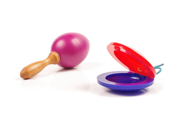 Child rattle and castanets isolated on the white background - Photo, Image