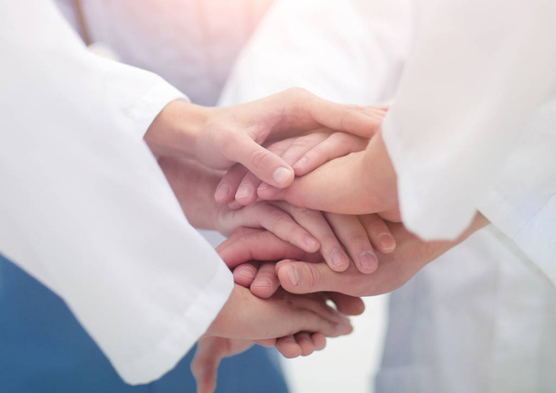 closeup.Small group of doctor team joining hands, - Photo, image