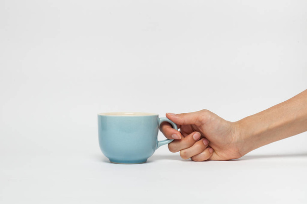 hand sign posture hold coffee cup in isolated - Фото, зображення