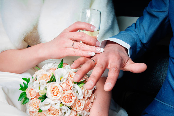 Bride and groom with glasses of champagne and flowers - Photo, Image