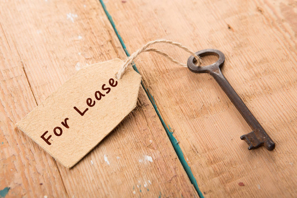 real estate lease concept - old key with tag - Fotó, kép