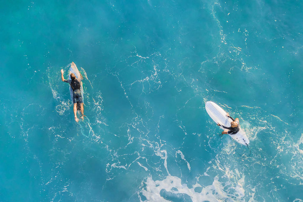 Two surfers in the ocean, top view - Фото, изображение