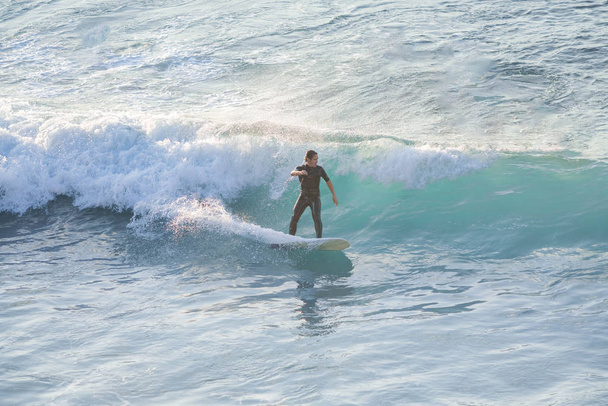 Bogliasco, Italy, October 6, 2017: Surfer in the ocean - 写真・画像