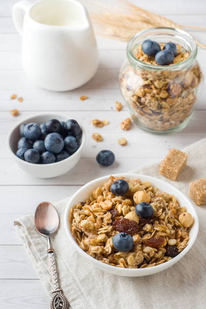Oat flakes, granules and nuts muesli with blueberries. The concept of healthy food, Breakfast - Fotó, kép