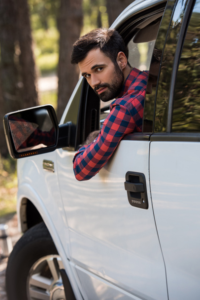 bearded driver in white pickup truck looking at camera - Zdjęcie, obraz